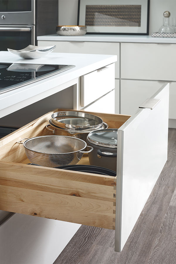 Two-drawer base cabinet with scooped drawer.